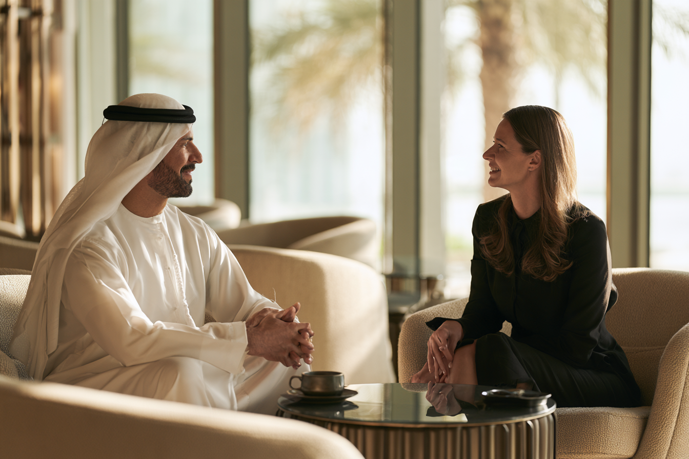 A man and a woman in conversation in a lounge
